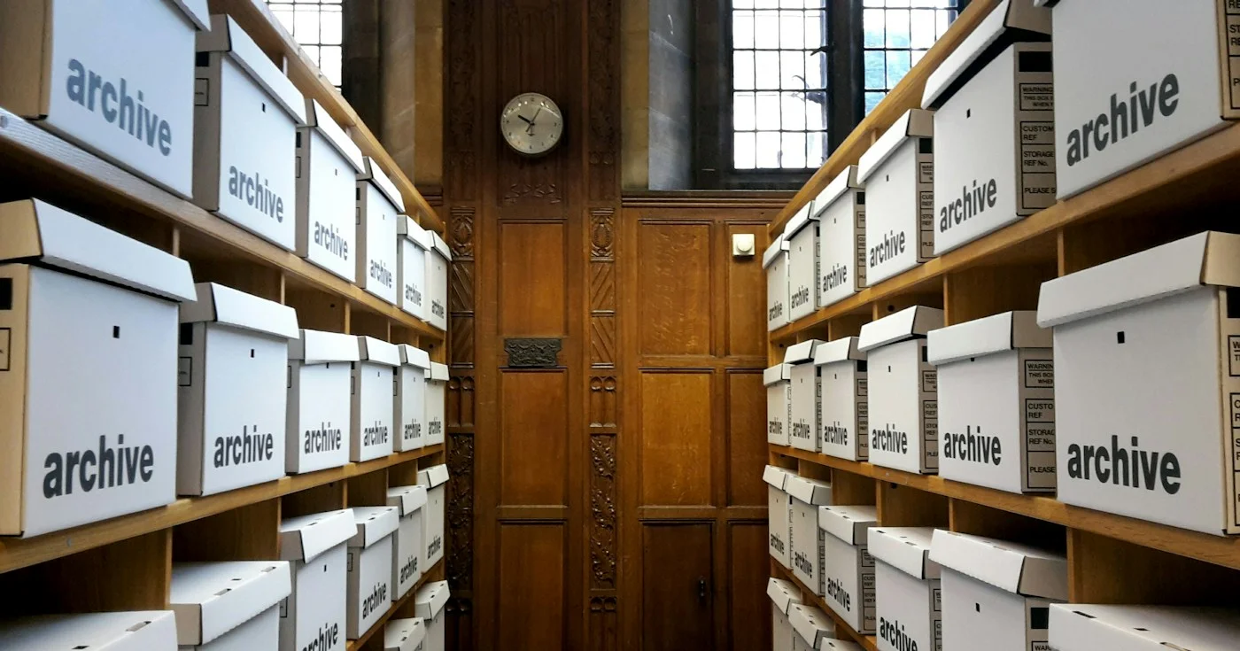 Shelves of archive boxes representing a retrievable knowledge corpus